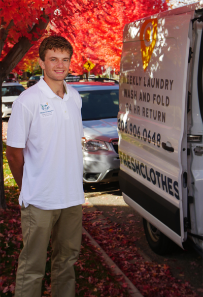 staff member standing by van